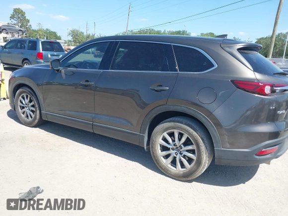 2019 Mazda CX-9 Touring with VIN JM3TCACY9K0304899, listed as a IAAI auction lot 42167180 with 57,043 mi miles and . Bid and sale history available at DreamBid. Image 3.