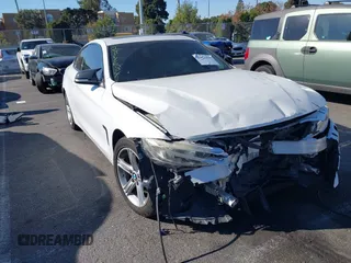 2014 BMW 4 Series 428i xDrive z VIN WBA3N5C56EF716566, wystawiony jako IAAI lot #41245322 z przebiegiem 72 252 mil mil oraz . Historia ofert i sprzedaży dostępna na DreamBid. Obrazek 1.