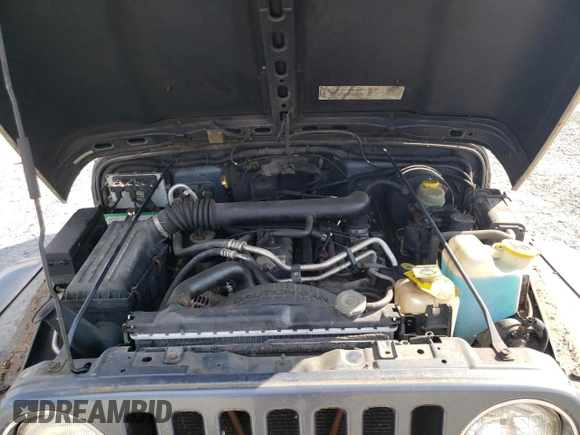 2002 Jeep Wrangler Sport с VIN 1J4FA49S02P734712, выставлен на аукционе Copart как лот 63310225 с пробегом 178 367 миль миль и Чистый • Clean title. История ставок и продаж доступна на DreamBid. Изображение 12.