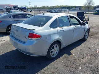 2008 Ford Focus SE with VIN 1FAHP35N48W243314, listed as a IAAI auction lot 42001321 with 210,639 mi miles. Bid and sale history available at carsss.com. Image 4.