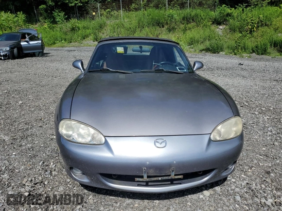 2002 Mazda MX-5 Miata Cloth z VIN JM1NB353520224582, wystawiony jako Copart lot #63669835 z przebiegiem 88 455 mil mil oraz Szkoda całkowita • Salvage title. Historia ofert i sprzedaży dostępna na DreamBid. Obrazek 5.
