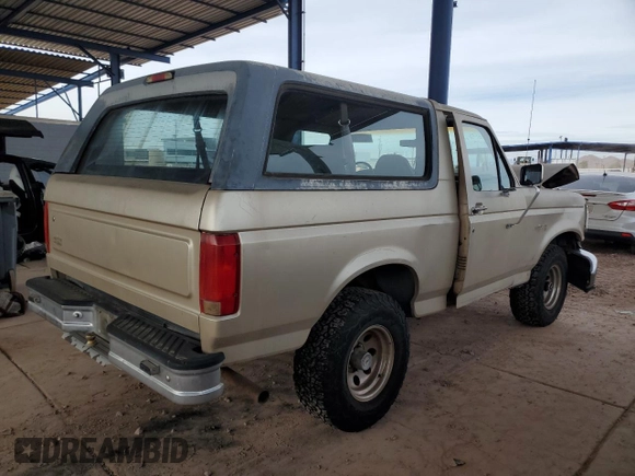 1996 Ford Bronco XL z VIN 1FMEU15N0TLB63427, wystawiony jako Copart lot #82779084 z przebiegiem 175 679 mil mil oraz Szkoda całkowita • Salvage title. Historia ofert i sprzedaży dostępna na DreamBid. Obrazek 3.