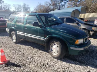 1997 GMC Jimmy SL with VIN 1GKCS13W2V2518446, listed as a Copart auction lot 86629634 with 183,089 mi miles and Salvage Title. Bid and sale history available at carsss.com. Image 4.