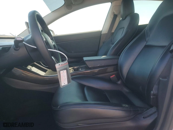 2019 Tesla Model 3 Mid Range with VIN 5YJ3E1EA5KF485617, listed as a Copart auction lot 42179575 with 101,257 mi miles and Salvage Title. Bid and sale history available at carsss.com. Image 7.