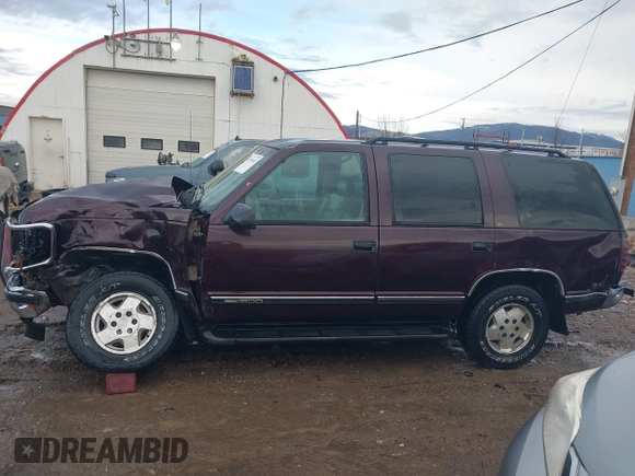 1997 GMC Yukon with VIN 1GKEK13R0VJ755574, listed as a IAAI auction lot 41158932 with 212,668 mi miles. Bid and sale history available at carsss.com. Image 15.
