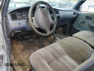 1997 Toyota T100 DX z VIN JT4UN22DXV0041578, wystawiony jako Copart lot #77388104 z przebiegiem 333 587 mil mil oraz Tytuł czysty. Historia ofert i sprzedaży dostępna na DreamBid. Obrazek 8.