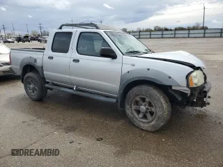 2002 Nissan Frontier SE with VIN 1N6ED27T92C379360, listed as a Copart auction lot 51235495 with 230,598 mi miles and Salvage title. Bid and sale history available at DreamBid. Image 4.