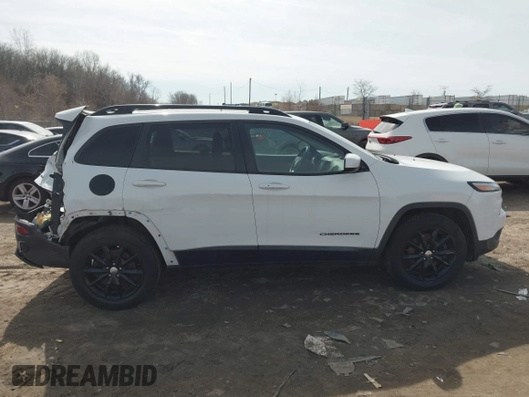 2014 Jeep Cherokee Latitude with VIN 1C4PJMCB1EW301011, listed as a IAAI auction lot 41777745 with 133,643 mi miles and . Bid and sale history available at DreamBid. Image 13.