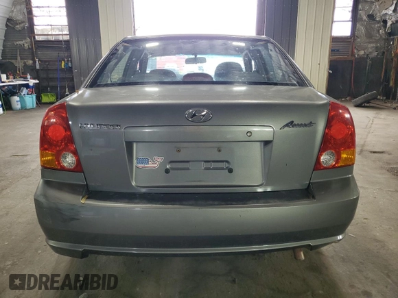 2005 Hyundai Accent GLS with VIN KMHCG45C95U632932, listed as a Copart auction lot 69448004 with 0 mi miles and Salvage Title. Bid and sale history available at carsss.com. Image 6.