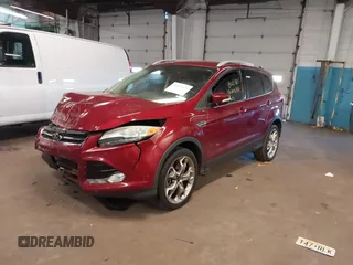 2014 Ford Escape Titanium with VIN 1FMCU9JX5EUC14849, listed as a IAAI auction lot 42037132 with 141,591 mi miles. Bid and sale history available at carsss.com. Image 2.