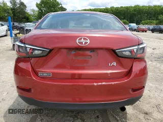 2016 Scion iA z VIN 3MYDLBZV6GY129364, wystawiony jako Copart lot #57217905 z przebiegiem 139 110 mil mil oraz Tytuł czysty. Historia ofert i sprzedaży dostępna na DreamBid. Obrazek 9.