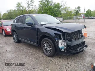 2017 Mazda CX-5 Touring z VIN JM3KFBCL4H0156571, wystawiony jako IAAI lot #42183562 z przebiegiem 135 595 mil mil oraz . Historia ofert i sprzedaży dostępna na DreamBid. Obrazek 1.