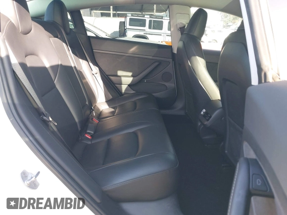 2023 Tesla Model 3 with VIN 5YJ3E1EA0PF503352, listed as a IAAI auction lot 41718658 with 28,426 mi miles and . Bid and sale history available at DreamBid. Image 8.