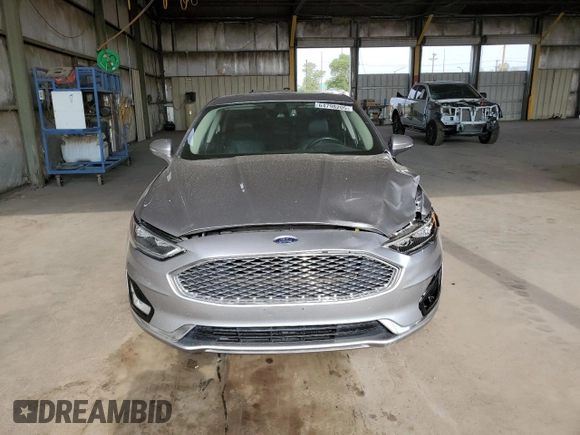 2020 Ford Fusion Titanium with VIN 3FA6P0RU5LR141507, listed as a Copart auction lot 64798205 with 113,216 mi miles and Salvage title. Bid and sale history available at DreamBid. Image 5.