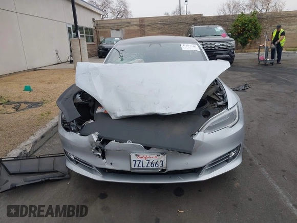 2017 Tesla Model S 60 with VIN 5YJSA1E17HF189627, listed as a IAAI auction lot 41891766 with 106,003 mi miles and . Bid and sale history available at DreamBid. Image 13.