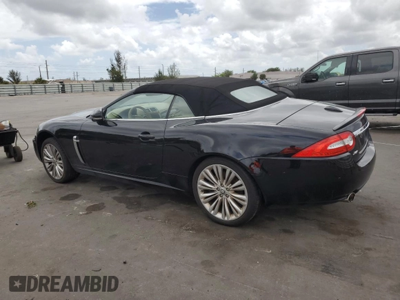 2011 Jaguar XK with VIN SAJWA4GB0BLB38875, listed as a Copart auction lot 52045805 with 35,487 mi miles and Salvage Title. Bid and sale history available at carsss.com. Image 2.