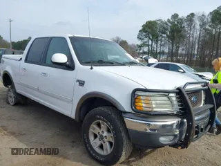 2003 Ford F-150 XLT with VIN 1FTRW08L73KA73945, listed as a IAAI auction lot 41474904 with 122,080 mi miles. Bid and sale history available at carsss.com. Image 1.