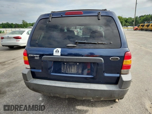 2003 Ford Escape XLT Popular with VIN 1FMCU03123KA03878, listed as a Copart auction lot 60133485 with 298,100 mi miles and Salvage title. Bid and sale history available at DreamBid. Image 6.