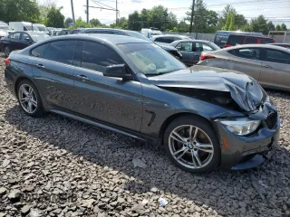 2015 BMW 4 Series 435i xDrive with VIN WBA4B3C51FGV48297, listed as a Copart auction lot 60950394 with 105,509 mi miles and Salvage Title. Bid and sale history available at DreamBid. Image 4.