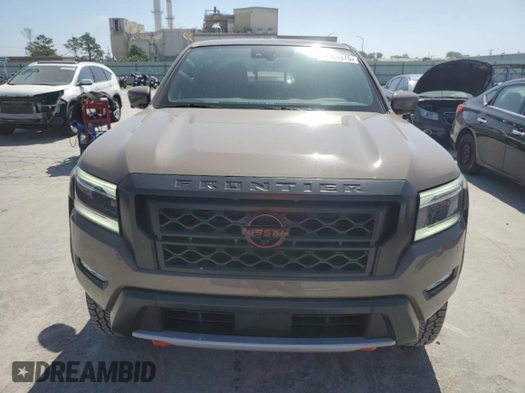 2023 Nissan Frontier Pro-4X with VIN 1N6ED1EK0PN668109, listed as a Copart auction lot 57064975 with 6,406 mi miles and Salvage title. Bid and sale history available at DreamBid. Image 5.
