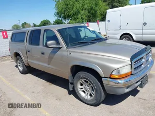 2004 Dodge Dakota SLT z VIN 1D7HL48N04S653798, wystawiony jako IAAI lot #42520546 z przebiegiem 115 259 mil mil oraz . Historia ofert i sprzedaży dostępna na DreamBid. Obrazek 1.