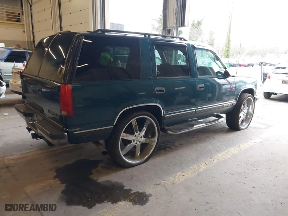 1997 Chevrolet Tahoe with VIN 1GNEK13R8VJ411512, listed as a IAAI auction lot 41583085 with 239,481 mi miles. Bid and sale history available at carsss.com. Image 4.