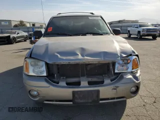 2003 GMC Envoy SLE with VIN 1GKDS13S332390989, listed as a Copart auction lot 74729104 with 127,680 mi miles and Salvage Title. Bid and sale history available at carsss.com. Image 5.