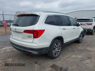 2017 Honda Pilot Elite with VIN 5FNYF6H04HB042192, listed as a IAAI auction lot 41780875 with 158,491 mi miles and . Bid and sale history available at DreamBid. Image 4.