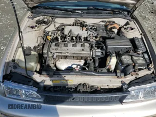 1995 Toyota Corolla DX with VIN 2T1AE09B0SC098739, listed as a Copart auction lot 57653205 with 154,226 mi miles and Salvage title. Bid and sale history available at DreamBid. Image 11.