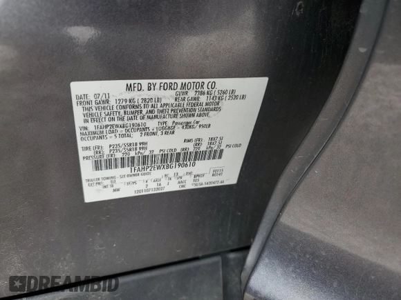 2011 Ford Taurus SEL z VIN 1FAHP2EWXBG190610, wystawiony jako Copart lot #56993785 z przebiegiem 119 784 mil mil oraz Szkoda całkowita • Salvage title. Historia ofert i sprzedaży dostępna na DreamBid. Obrazek 13.