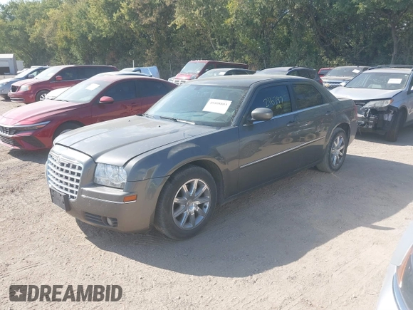 2009 Chrysler 300 Touring with VIN 2C3LA53V09H520923, listed as a IAAI auction lot 40408803 with 216,747 mi miles. Bid and sale history available at carsss.com. Image 2.