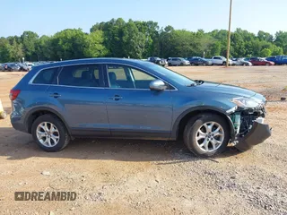 2014 Mazda CX-9 Touring with VIN JM3TB3CV7E0435659, listed as a IAAI auction lot 42428247 with 124,523 mi miles and . Bid and sale history available at DreamBid. Image 13.
