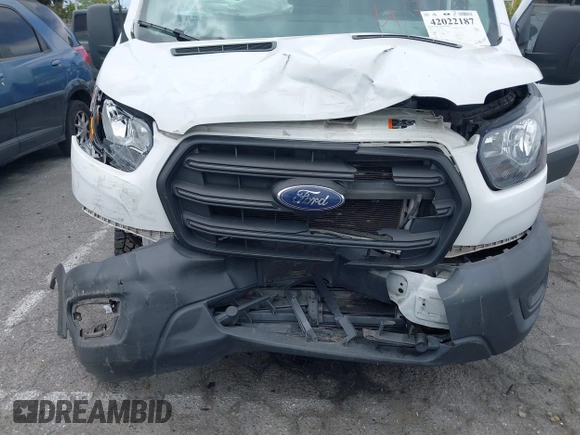 2020 Ford Transit Cargo with VIN 1FTBW3XG2LKB18281, listed as a IAAI auction lot 42022187 with 84,323 mi miles. Bid and sale history available at carsss.com. Image 6.