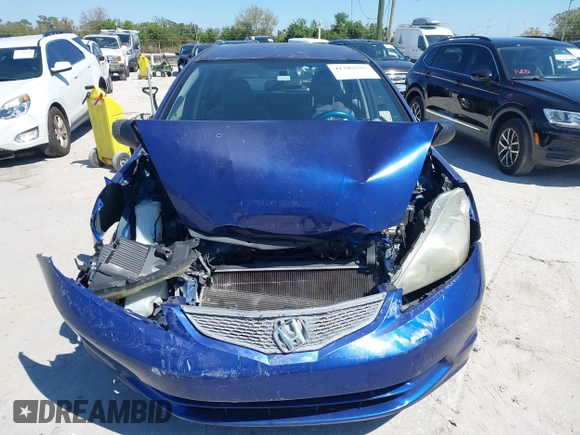 2009 Honda Fit with VIN JHMGE88249S056575, listed as a IAAI auction lot 41702555 with 116,658 mi miles. Bid and sale history available at carsss.com. Image 12.