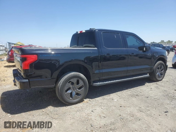 2023 Ford F-150 Lightning Pro with VIN 1FTVW1EV1PWG17333, listed as a Copart auction lot 57904025 with 21,173 mi miles and Salvage title. Bid and sale history available at DreamBid. Image 3.