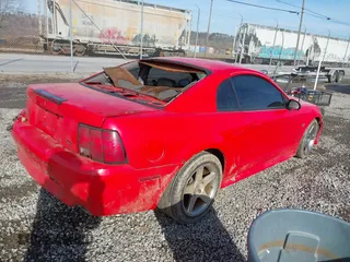 2000 Ford Mustang GT with VIN 1FAFP42X8YF269210, listed as a IAAI auction lot 41578741 with 134,210 mi miles. Bid and sale history available at carsss.com. Image 4.