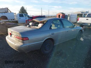 1997 Toyota Camry LE z VIN 4T1BG22K0VU019383, wystawiony jako IAAI lot #41271457 z przebiegiem 175 214 mil mil oraz . Historia ofert i sprzedaży dostępna na DreamBid. Obrazek 4.
