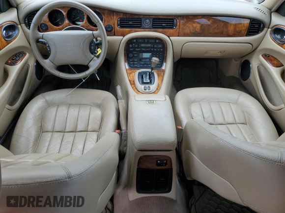 1999 Jaguar XJ with VIN SAJHX1040XC864208, listed as a Copart auction lot 59748585 with 130,577 mi miles and Clean title. Bid and sale history available at DreamBid. Image 8.