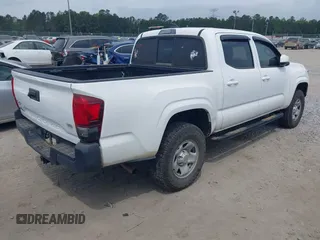 2022 Toyota Tacoma SR with VIN 3TYCZ5AN9NT098903, listed as a IAAI auction lot 42088505 with 93,000 mi miles and . Bid and sale history available at DreamBid. Image 4.