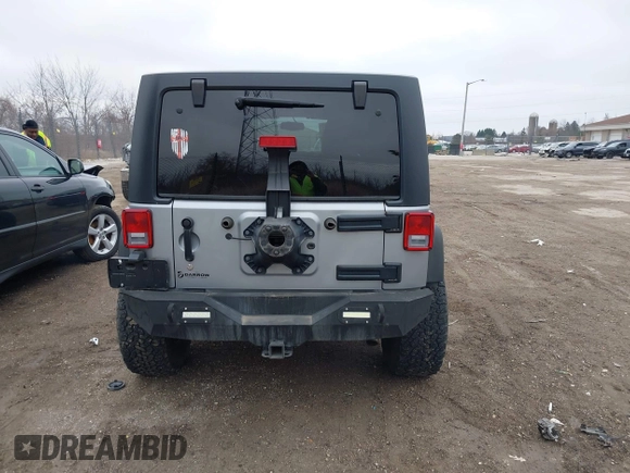 2013 Jeep Wrangler Unlimited Rubicon z VIN 1C4BJWFG7DL667083, wystawiony jako IAAI lot #42016912 z przebiegiem 148 933 mil mil oraz . Historia ofert i sprzedaży dostępna na DreamBid. Obrazek 16.