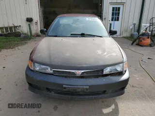 2000 Mitsubishi Mirage DE z VIN JA3AY26C1YU026930, wystawiony jako Copart lot #74153834 z przebiegiem 126 800 mil mil oraz Czysty tytuł • Clean title. Historia ofert i sprzedaży dostępna na DreamBid. Obrazek 5.