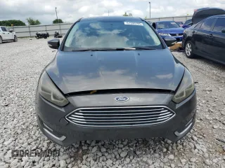 2017 Ford Focus Titanium z VIN 1FADP3N22HL307260, wystawiony jako Copart lot #61399785 z przebiegiem 103 293 mil mil oraz Szkoda całkowita • Salvage title. Historia ofert i sprzedaży dostępna na DreamBid. Obrazek 5.