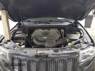 2015 Jeep Grand Cherokee Laredo with VIN 1C4RJFAG3FC115444, listed as a IAAI auction lot 41248211 with 138,828 mi miles. Bid and sale history available at carsss.com. Image 10.