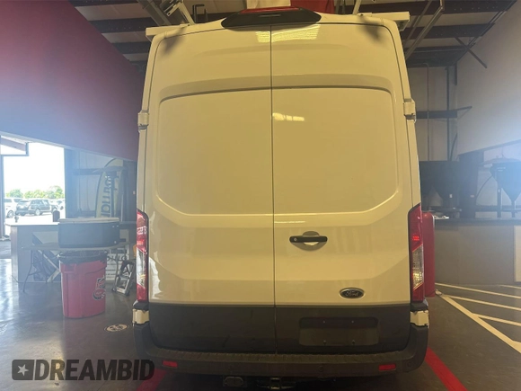 2023 Ford Transit Cargo with VIN 1FTBR1X86PKC09421, listed as a IAAI auction lot 42843981 with 10,233 mi miles and . Bid and sale history available at DreamBid. Image 18.