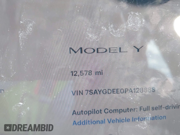 2023 Tesla Model Y Long Range z VIN 7SAYGDEE0PA128888, wystawiony jako IAAI lot #41410085 z przebiegiem 12 578 mil mil oraz . Historia ofert i sprzedaży dostępna na DreamBid. Obrazek 7.
