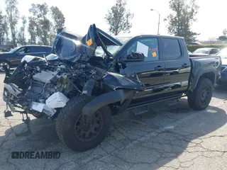 2025 Toyota Tacoma SR with VIN 3TMLB5JN2SM090007, listed as a IAAI auction lot 41830185 with 4,359 mi miles and . Bid and sale history available at DreamBid. Image 17.