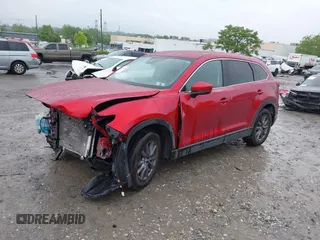 2022 Mazda CX-9 Touring with VIN JM3TCBCY9N0613508, listed as a IAAI auction lot 42258870 with 46,911 mi miles and . Bid and sale history available at DreamBid. Image 2.