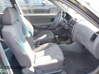 2005 Hyundai Accent GLS with VIN KMHCG35C95U365902, listed as a IAAI auction lot 41715161 with 149,766 mi miles. Bid and sale history available at carsss.com. Image 5.