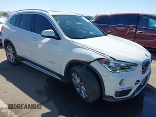 2017 BMW X1 xDrive28i with VIN WBXHT3C30H5F68187, listed as a IAAI auction lot 41830892 with 101,313 mi miles. Bid and sale history available at carsss.com. Image 1.