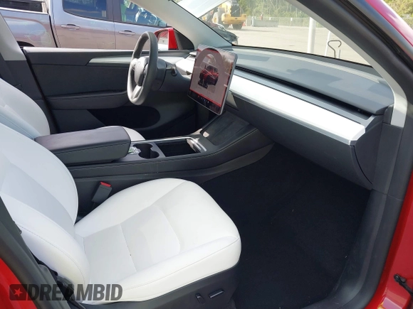 2023 Tesla Model Y Long Range with VIN 7SAYGDEE1PA154996, listed as a IAAI auction lot 41472595 with 24,861 mi miles and . Bid and sale history available at DreamBid. Image 5.